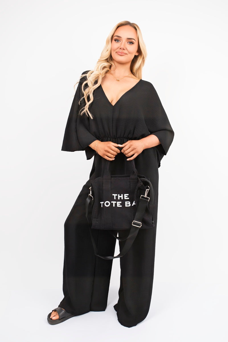 Wide Leg V Neck Jumpsuit with Back Tie Detail